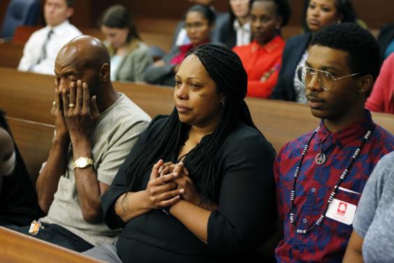 Marquez Tolbert (right) with his mother and grandfather in court (credit: Associated Press)
