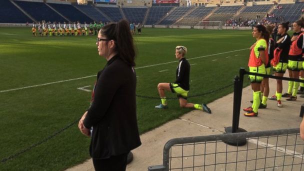 Rapinoe kneeling during the National Anthem at the start of a recent match.